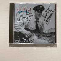 The Complete 50’s Masters Box set. With book signed by Scotty Moore and DJ Fontana and CD also signed by Scotty Moore and DJ Fontana.