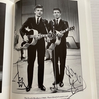 A Record of Pop book signed by Jack Parnell (dedicated to Nigel), Lita Roza, Don Lusher (dedicated to Nigel), Max Bygraves, Frankie Vaughan, Anthony Newley, The Everley Brothers, Alan Freeman?, Jim Da