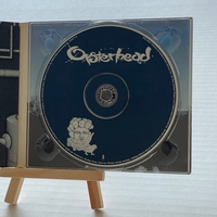 Oysterhead - The Grand Pecking Order CD. Signed by Stewart Copeland