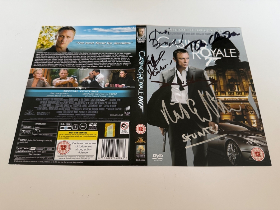 SIGNED JAMES BOND "CASINO ROYALE" DVD SLEEVE FROM JUDI DENCH, DAVID ARNOLD, RICK ENGLISH, JOSEPH MILLSON AND TOM CHADBON.