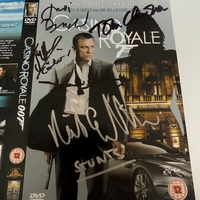 SIGNED JAMES BOND "CASINO ROYALE" DVD SLEEVE FROM JUDI DENCH, DAVID ARNOLD, RICK ENGLISH, JOSEPH MILLSON AND TOM CHADBON.