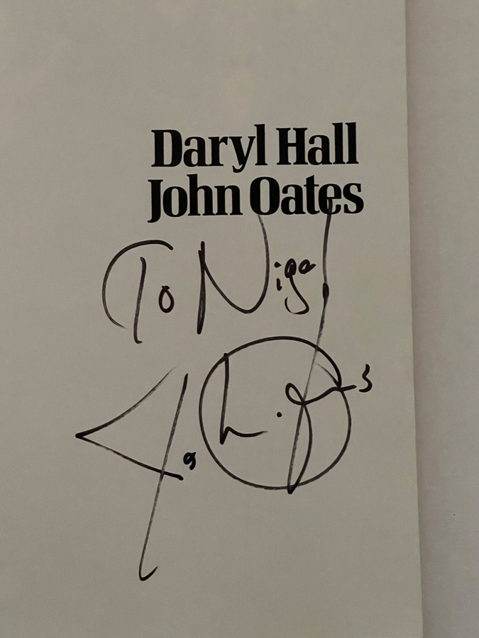 Daryl Hall and John Oates - Dangerous Dances paperback book. Personalised to Nigel, signed by John Oates