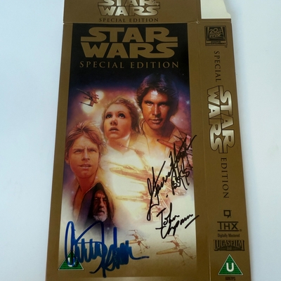 Star Wars Special Edition VHS cover signed by Carrie Fisher, Garrick Hagon “Biggs” and John Chapman (Drifter - Red 12)