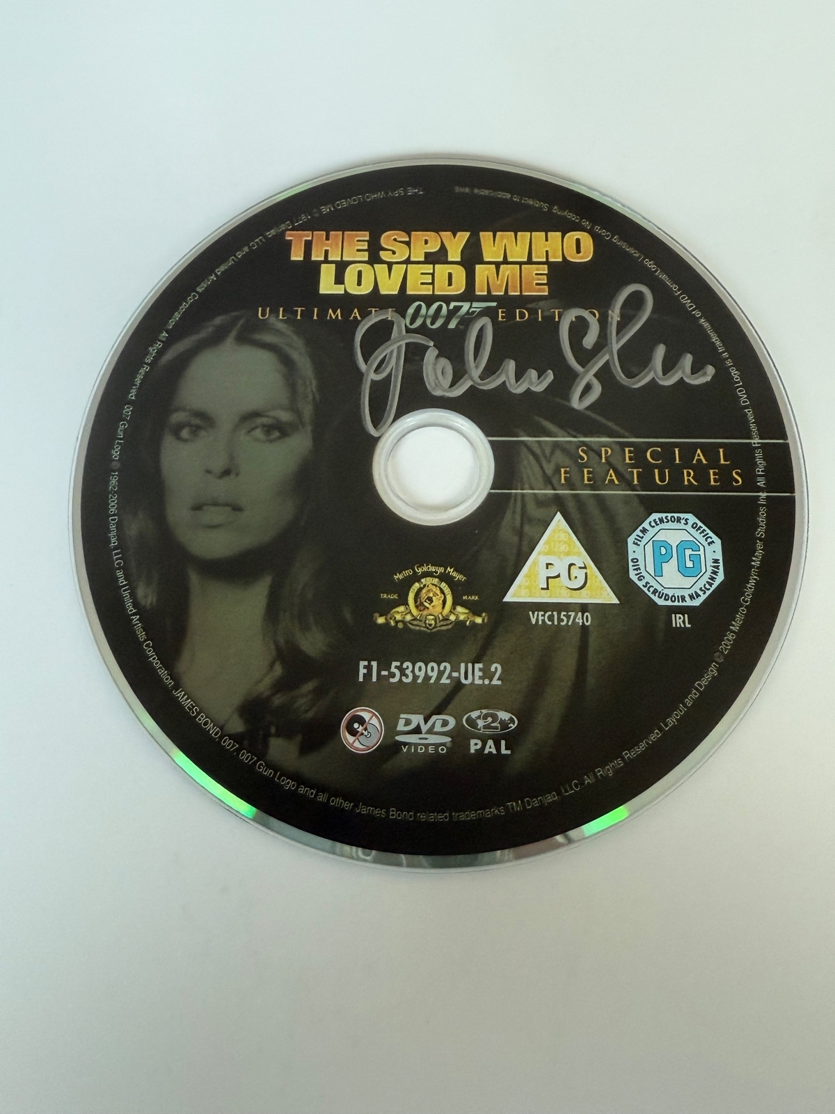 The Spy Who Loved Me DVD disc, signed by John Glen. Disc only