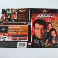 Tomorrow Never Dies DVD sleeve signed by Judi Dench, Hugh Bonneville, Tracey Eddon (stunts) and Abbi Collins (stunts). Cover only