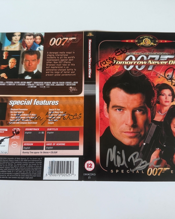 Tomorrow Never Dies DVD sleeve signed by Judi Dench, Hugh Bonneville, Tracey Eddon (stunts) and Abbi Collins (stunts). Cover only