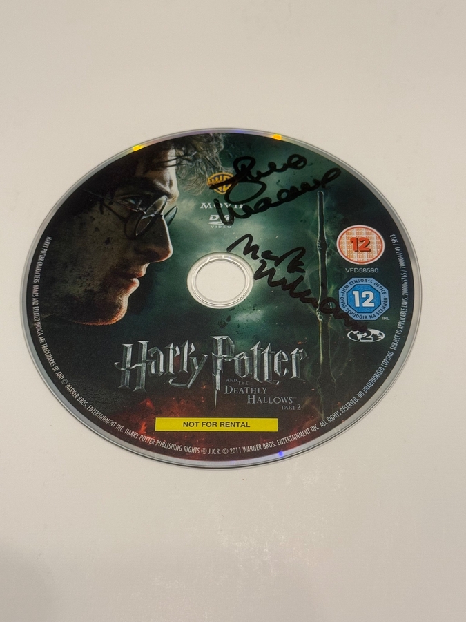 Harry Potter and The Deathly Hallows Part 2 DVD disc signed by Julie Walters and Mark Williams. Disc only
