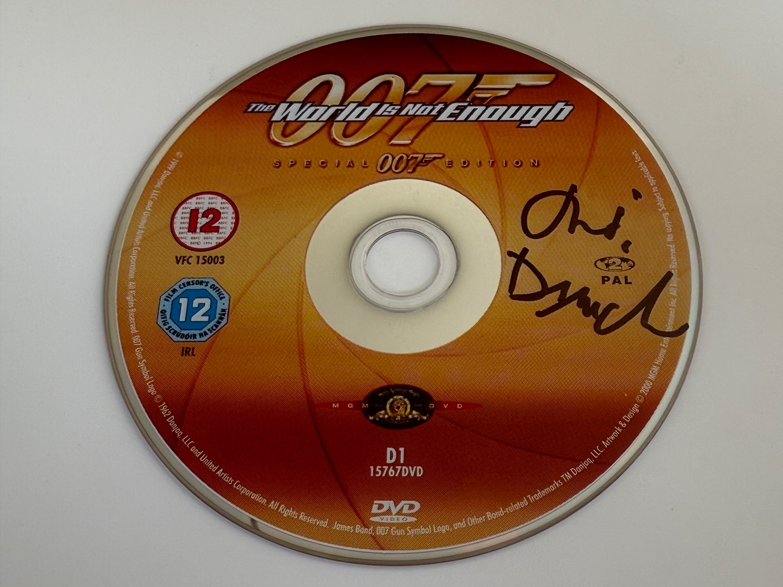 The World Is Not Enough DVD - signed by Judi Dench. Disc only