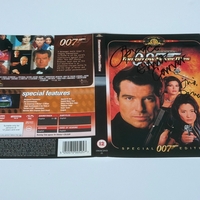 Tomorrow Never Dies DVD sleeve signed by Jonathan Pryce, Elliott Carver and Judi Dench. DVD sleeve only