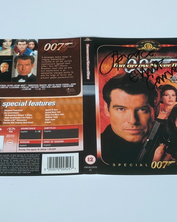 Tomorrow Never Dies DVD sleeve signed by Jonathan Pryce, Elliott Carver and Judi Dench. DVD sleeve only