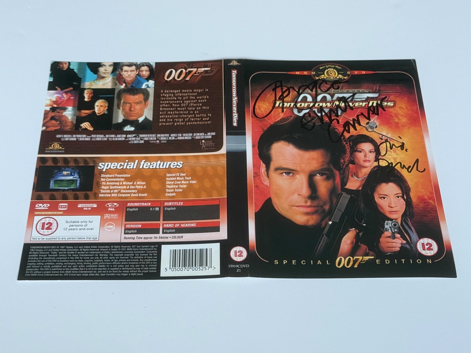 Tomorrow Never Dies DVD sleeve signed by Jonathan Pryce, Elliott Carver and Judi Dench. DVD sleeve only