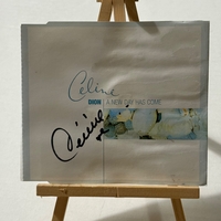 Celine Dion - A New Day Has Come CD. Signed by Celine Dion. Water Damaged