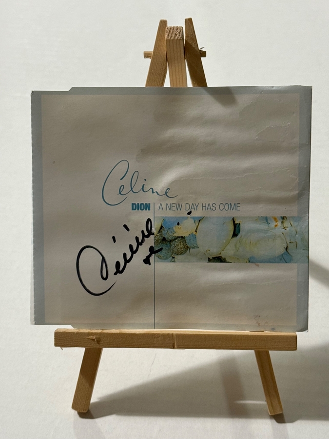 Celine Dion - A New Day Has Come CD. Signed by Celine Dion. Water Damaged