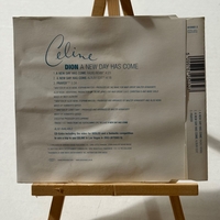 Celine Dion - A New Day Has Come CD. Signed by Celine Dion. Water Damaged