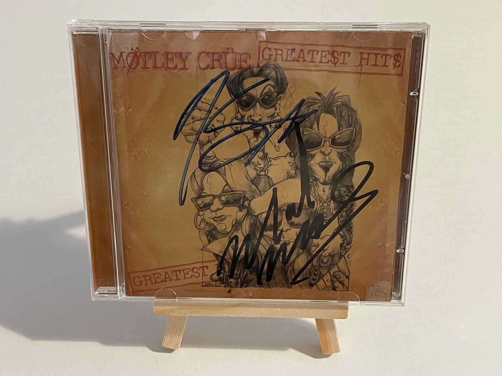 Motley Crue - Greatest Hits Cd, signed by Mick Mars, Nikki Sixx, Tommy Lee and Vince Neil