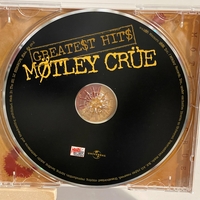 Motley Crue - Greatest Hits Cd, signed by Mick Mars, Nikki Sixx, Tommy Lee and Vince Neil