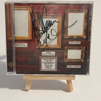 Emerson Lake and Palmer - Pictures at an exhibition. Front cover signed by Keith Emerson and Carl Palmer. CD signed by Keith Emerson, Greg Lake and Carl Palmer