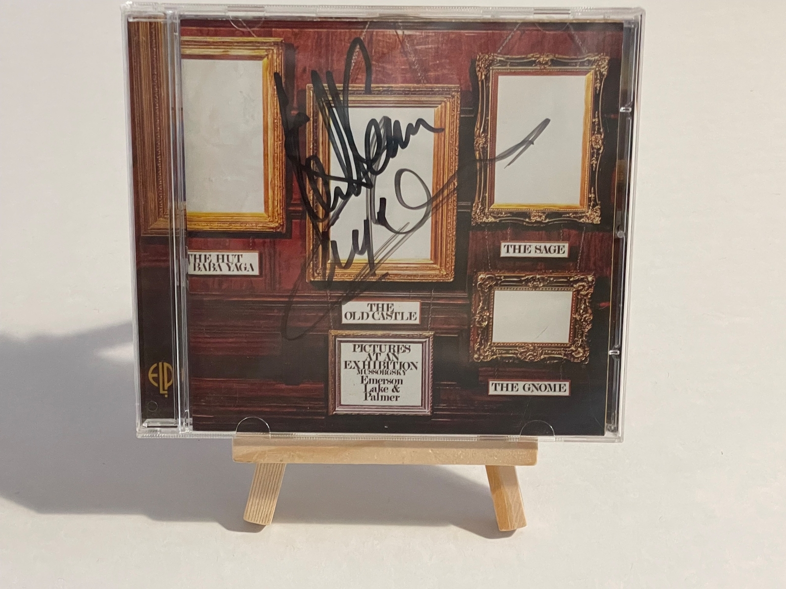 Emerson Lake and Palmer - Pictures at an exhibition. Front cover signed by Keith Emerson and Carl Palmer. CD signed by Keith Emerson, Greg Lake and Carl Palmer