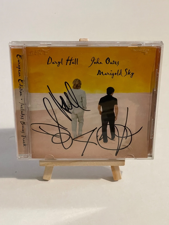 Daryl Hall and John Oates. Marigold Sky. Signed by Daryl Hall and John Oates