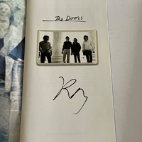 The Doors Box set. Signed on booklet by Ray Manzarek. Signed on rear of “The future ain’t what it used to be” cd by Ray Manzarek and also to rear of another cd by Ray Manzarek (Smudged)
