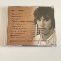 The Doors Box set. Signed on booklet by Ray Manzarek. Signed on rear of “The future ain’t what it used to be” cd by Ray Manzarek and also to rear of another cd by Ray Manzarek (Smudged)