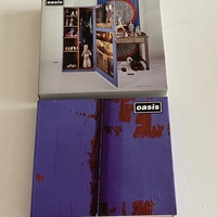Oasis - Stop The Clocks CD boxset. Signed by Andy Bell