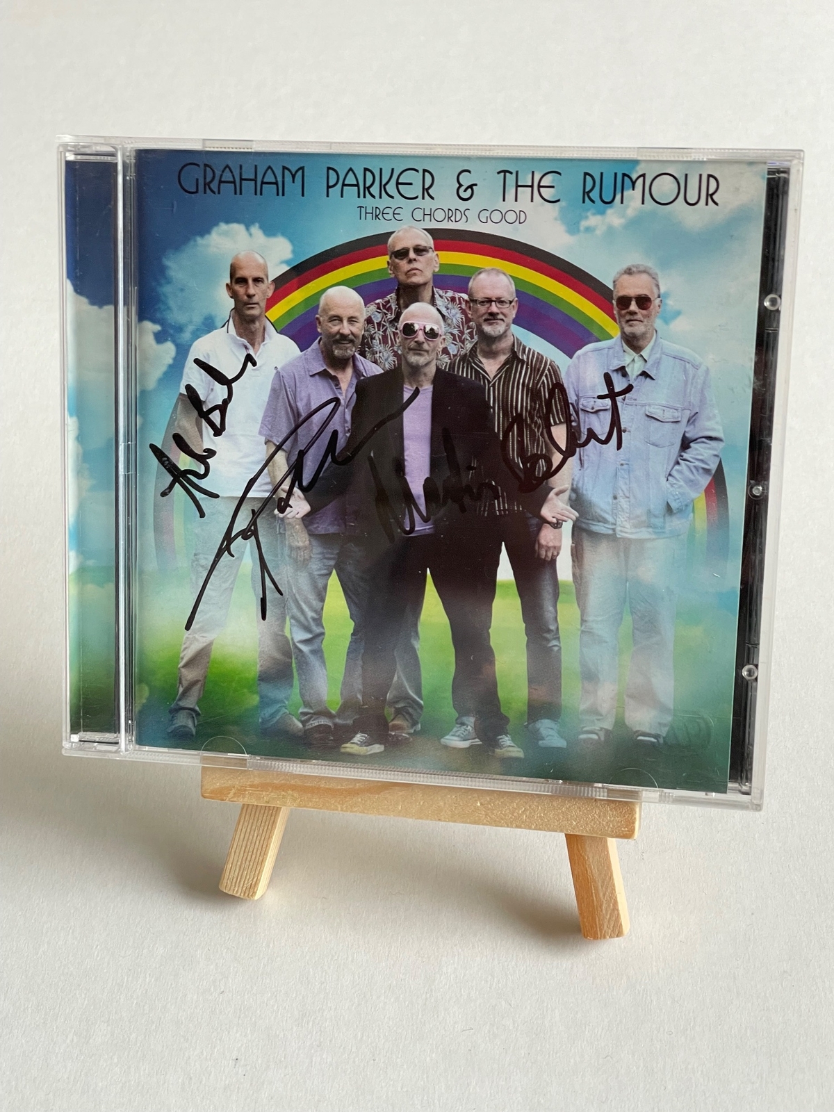 Graham Parker and The Rumour - Three Chords Good CD. Believed to be signed on front cover by Andrew Bodnar, Graham Parker and Martin Belmont. Signed on back of booklet by Bob Andrews
