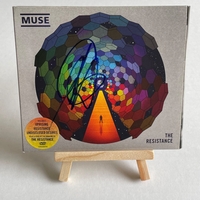Muse - The Resistance CD. Signed by Chris Wolstenholme on front cover and Dominic Howard on card