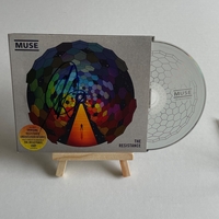 Muse - The Resistance CD. Signed by Chris Wolstenholme on front cover and Dominic Howard on card