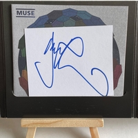 Muse - The Resistance CD. Signed by Chris Wolstenholme on front cover and Dominic Howard on card