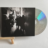 Muse - The Resistance CD. Signed by Chris Wolstenholme on front cover and Dominic Howard on card