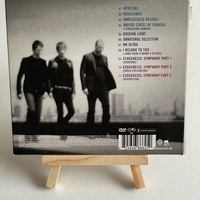 Muse - The Resistance CD. Signed by Chris Wolstenholme on front cover and Dominic Howard on card