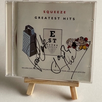 Squeeze - Greatest Hits CD. Signed on front by Paul Carrack, Jools Holland. On the rear, Chris Difford? Plus possibly one other