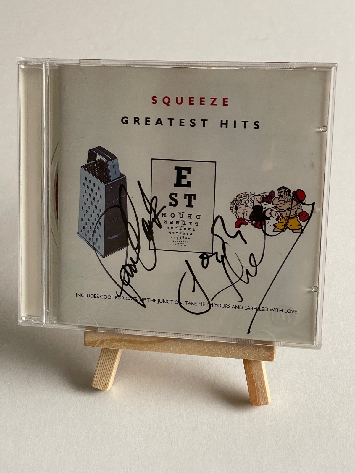 Squeeze - Greatest Hits CD. Signed on front by Paul Carrack, Jools Holland. On the rear, Chris Difford? Plus possibly one other