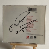 Squeeze - Greatest Hits CD. Signed on front by Paul Carrack, Jools Holland. On the rear, Chris Difford? Plus possibly one other
