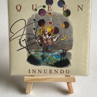 Queen - Innuendo CD signed by Roger Taylor and Bryan May in silver on the rear