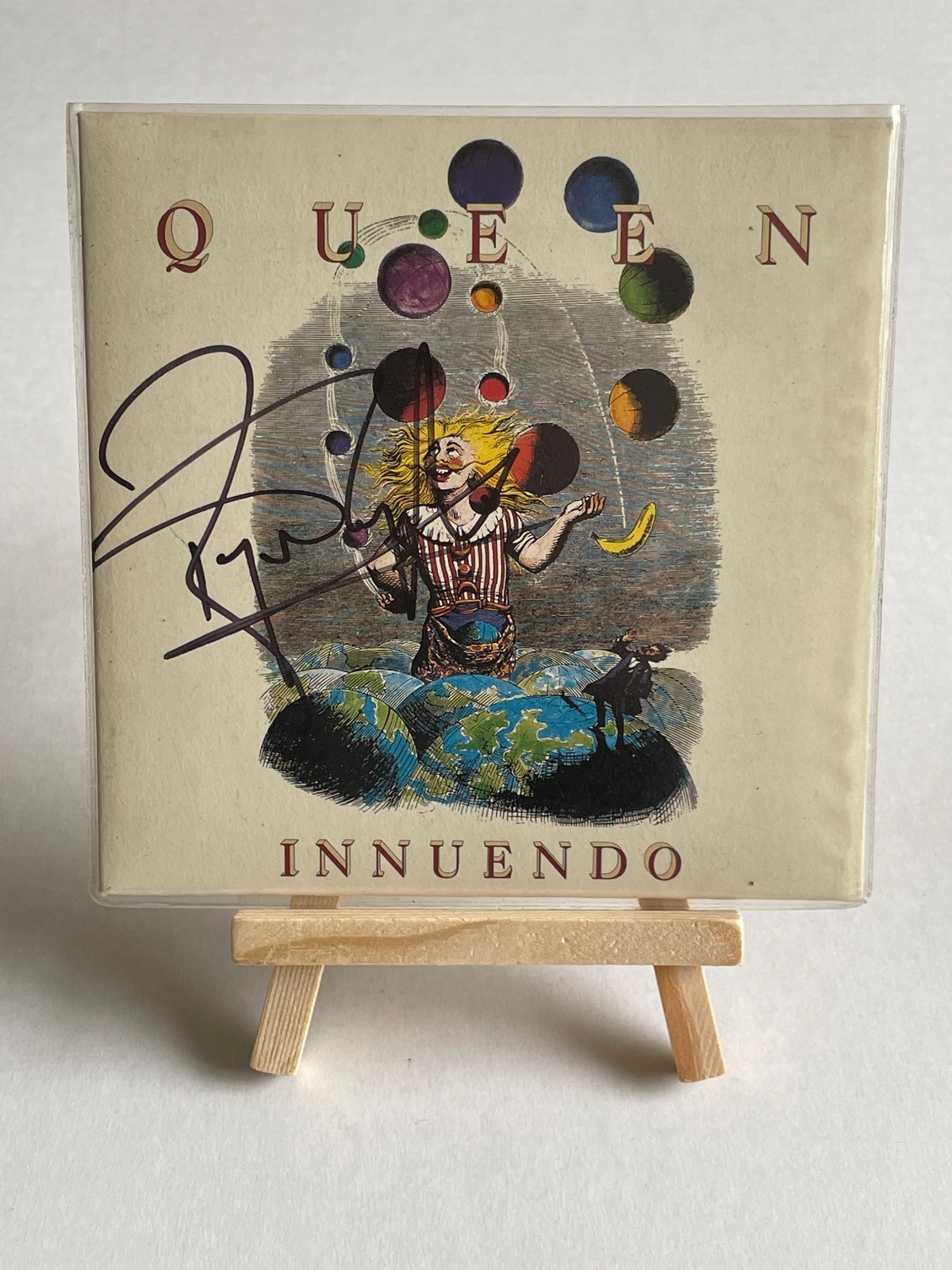 Queen - Innuendo CD signed by Roger Taylor and Bryan May in silver on the rear