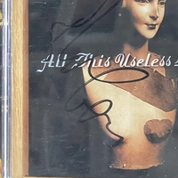Elvis Costello and the attractions - All This Useless Beauty. Signed by Elvis Costello to front cover and Steve Nieve on rear page
