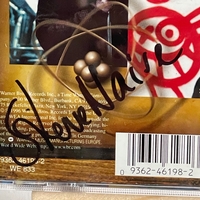 Elvis Costello and the attractions - All This Useless Beauty. Signed by Elvis Costello to front cover and Steve Nieve on rear page