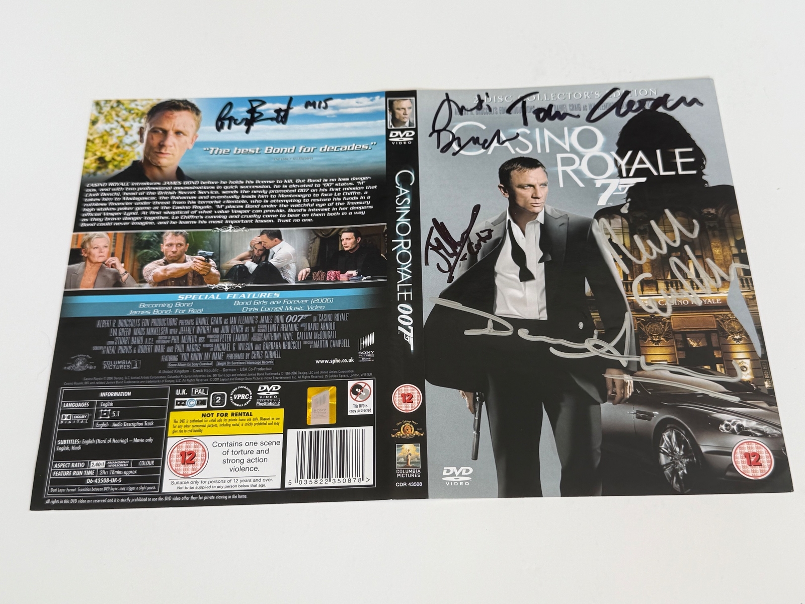 Casino Royale DVD cover signed by Judi Dench, Joseph Millson, Greg Bennett, Rick English, Tom Chadbon and David Arnold. DVD sleeve only