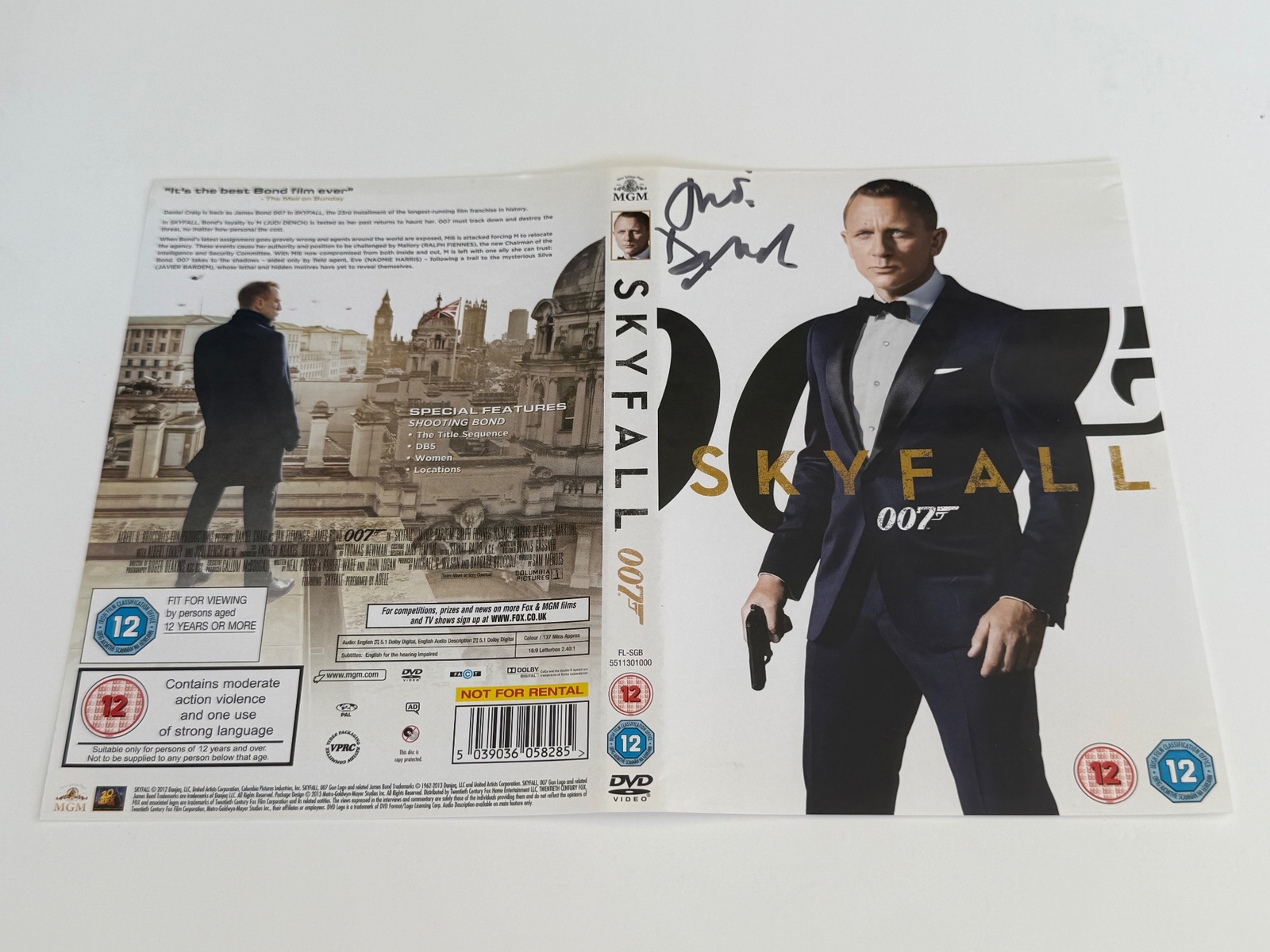 Skyfall DVD cover signed by Judi Dench. DVD sleeve only