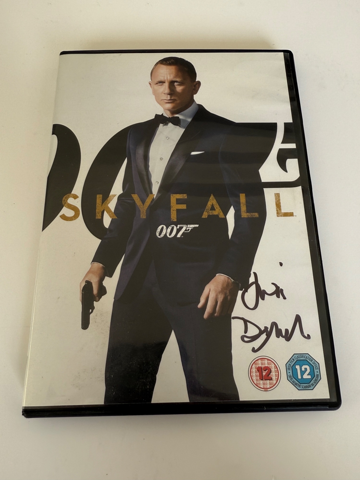 Skyfall DVD cover signed by Judi Dench.