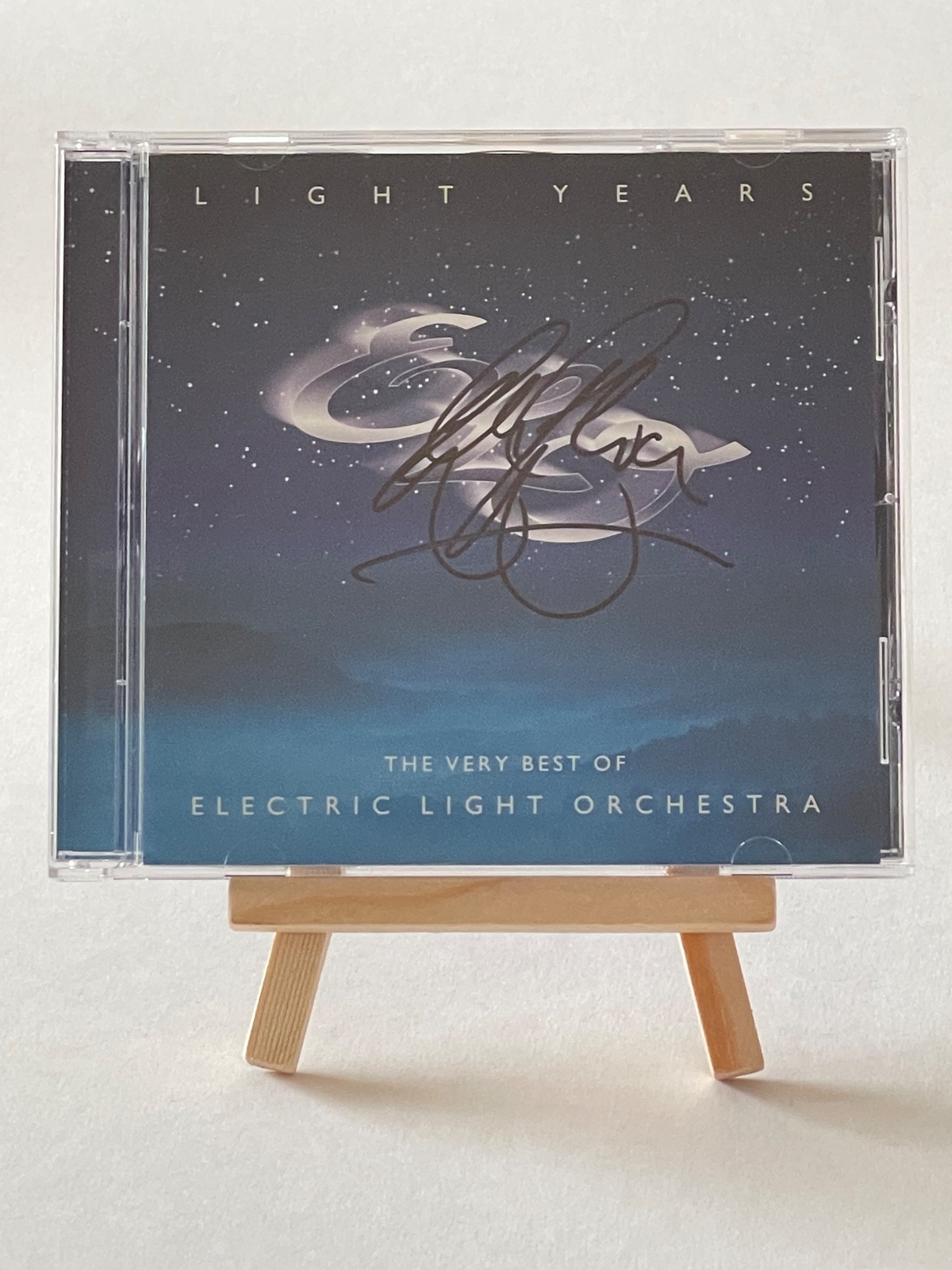 Electric Light Orchestra - Light Years. Signed on front of book cover by: Bev Bevan. Signed on rear page by: Kelly Groucutt, Louis Clark and Mik Kaminski
