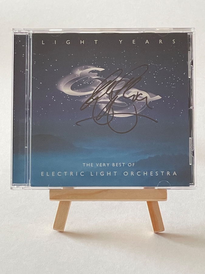 Electric Light Orchestra - Light Years. Signed on front of book cover by: Bev Bevan. Signed on rear page by: Kelly Groucutt, Louis Clark and Mik Kaminski