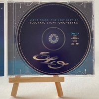 Electric Light Orchestra - Light Years. Signed on front of book cover by: Bev Bevan. Signed on rear page by: Kelly Groucutt, Louis Clark and Mik Kaminski