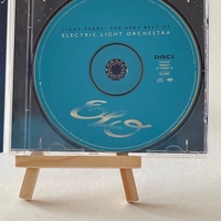 Electric Light Orchestra - Light Years. Signed on front of book cover by: Bev Bevan. Signed on rear page by: Kelly Groucutt, Louis Clark and Mik Kaminski
