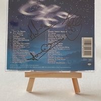 Electric Light Orchestra - Light Years. Signed on front of book cover by: Bev Bevan. Signed on rear page by: Kelly Groucutt, Louis Clark and Mik Kaminski