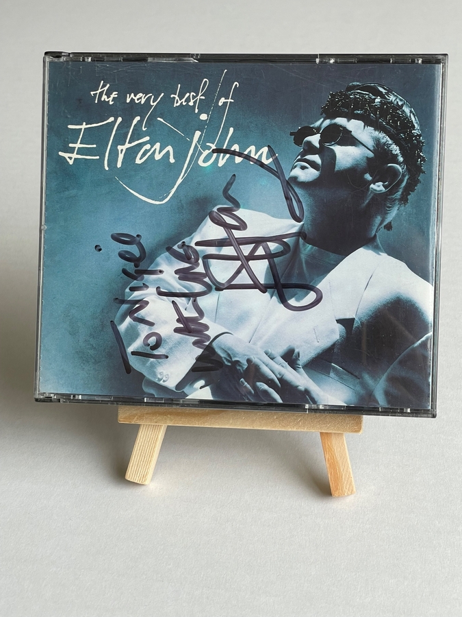 Elton John - The Very Best of CD. Signed by Elton John, personalised to Nigel