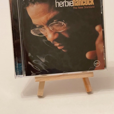 Herbie Hancock - The New Standard CD. Believed to be signed by Michael Brecker, John Schofield, Dave Holland and Herbie Hancock