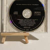 The Cure - Staring At The Sea CD. Signed by Robert Smith, Simon Gallup, Roger O’Donnell, Jason Cooper & Perry Bamonte